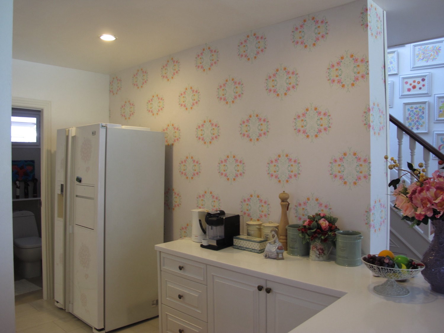 The same flower pattern printed at full scale across an entire wall of the home