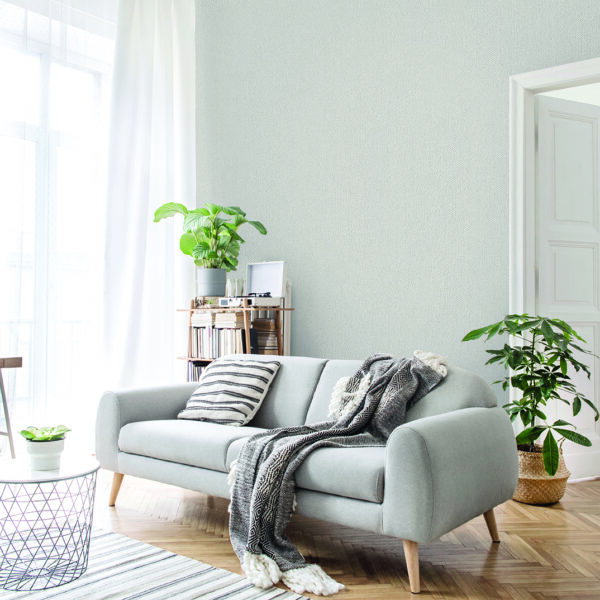 Stylish scandinavian living room with design furniture, plants, bamboo bookstand and wooden desk. Brown wooden parquet. Abstract painting on the white wall. Nice apartment. Modern decor of bright room; Shutterstock ID 1471595687; Purchase Order: -
